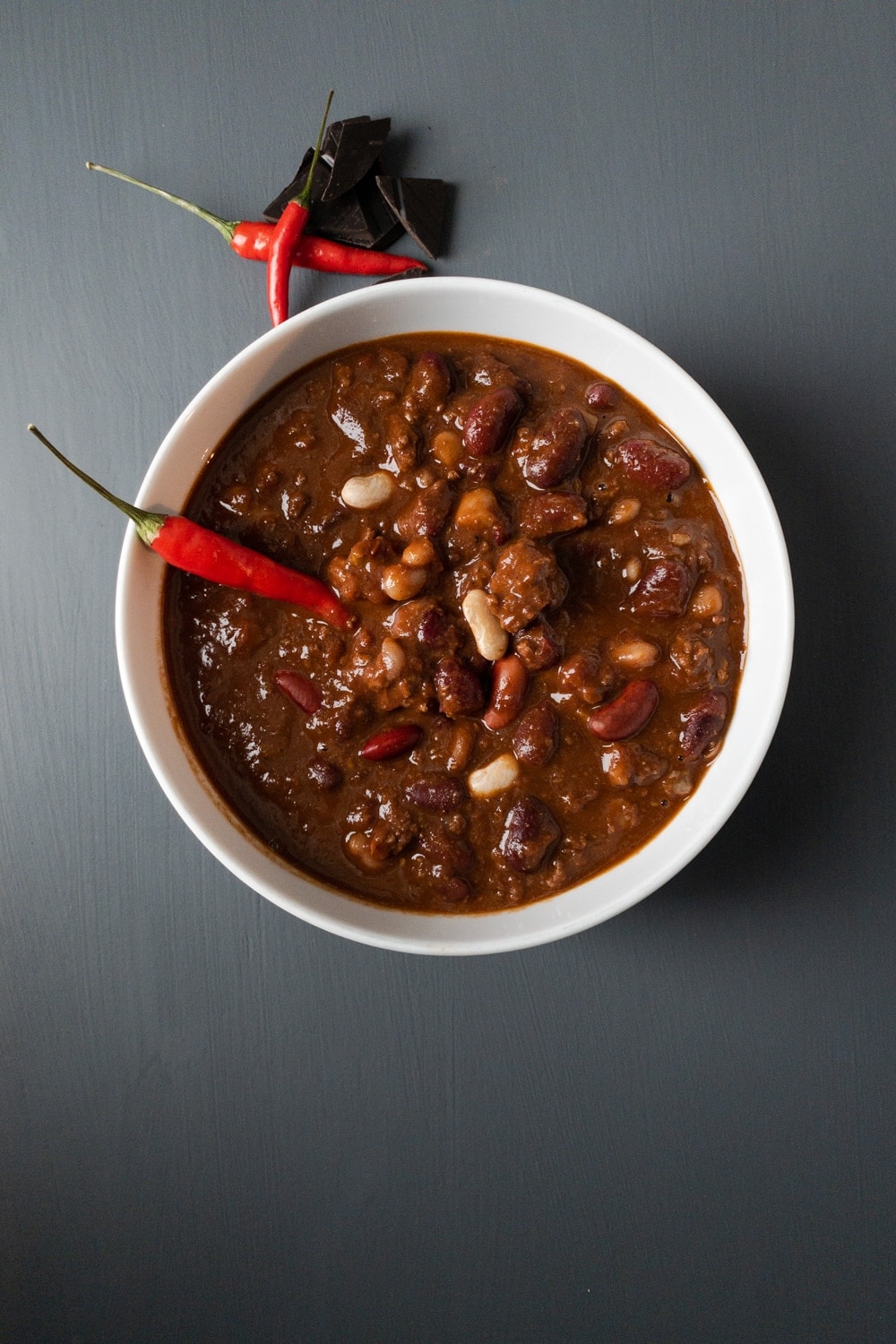 Chilli con Carne in a bowl with a chili  pepper and chocolate decoration