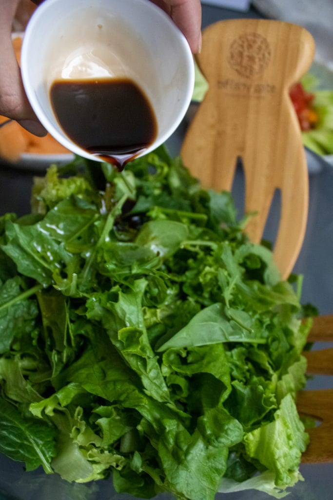 Step Instructions - pour balsamic onto the lettuce