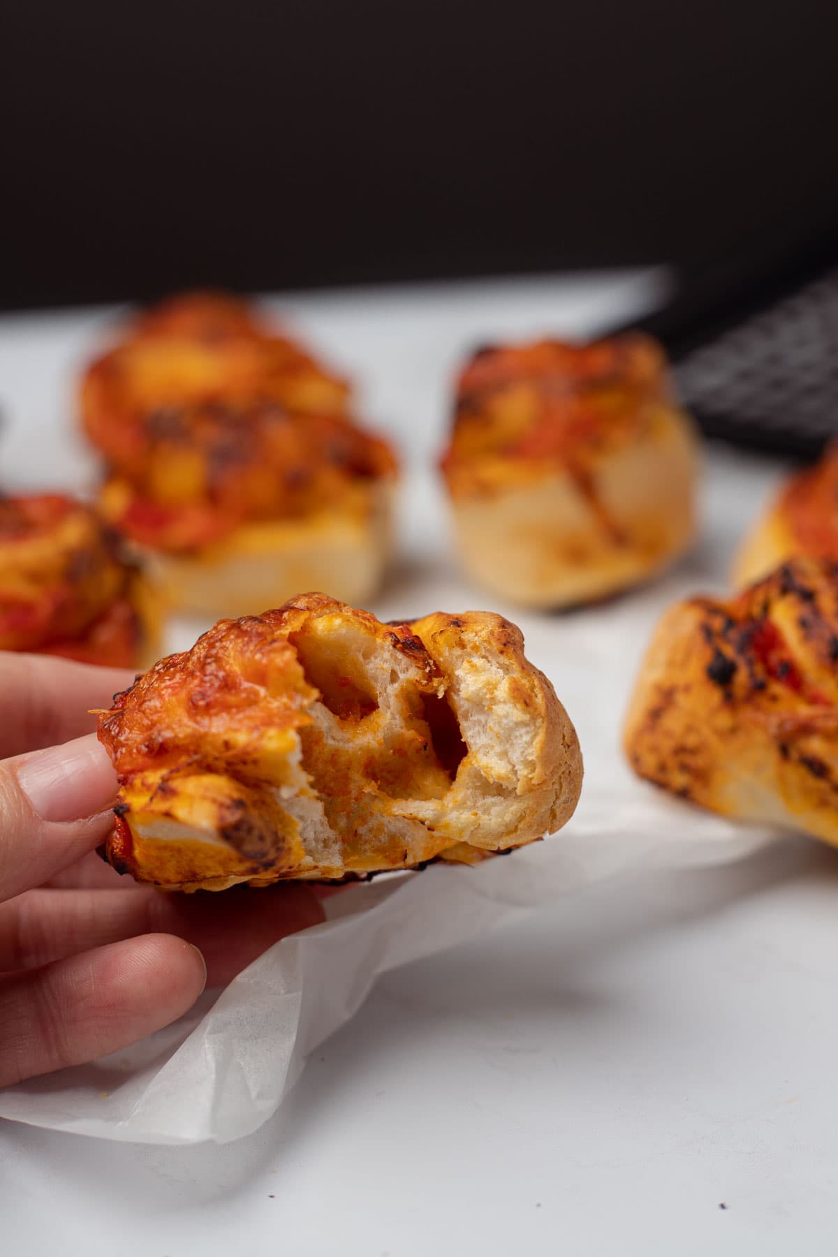 Bite picture of homemade pizza rolls.